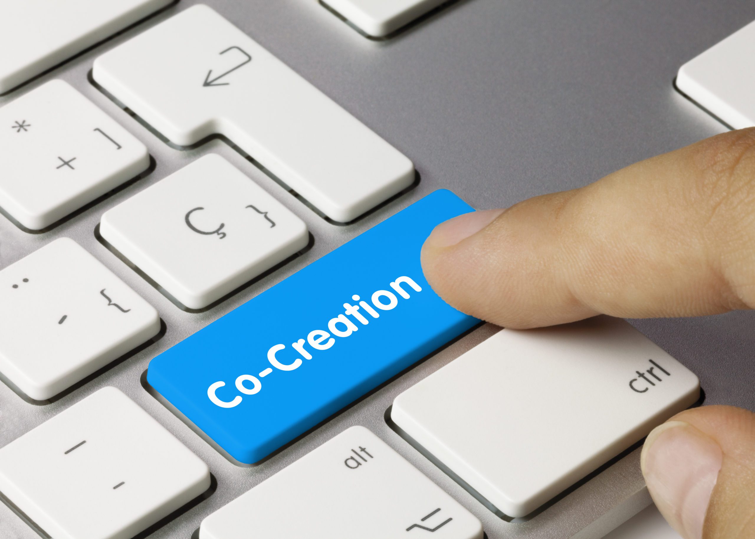 Co-Creation - Inscription on Blue Keyboard Key.